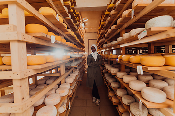 Image showing Arab investor in a warehouse of the cheese production industry