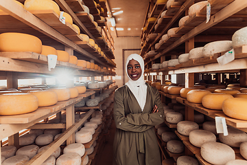 Image showing Arab investor in a warehouse of the cheese production industry