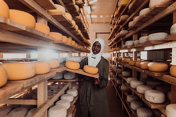 Image showing Arab investor in a warehouse of the cheese production industry