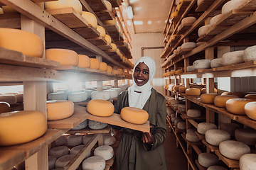 Image showing Arab investor in a warehouse of the cheese production industry