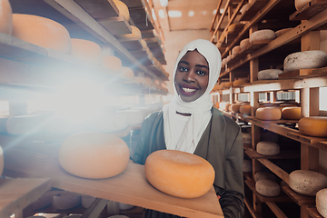 Image showing Arab investor in a warehouse of the cheese production industry