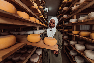 Image showing Arab investor in a warehouse of the cheese production industry