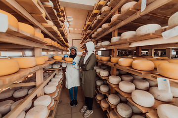 Image showing Arab business partner visiting a cheese factory. The concept of investing in small businesses