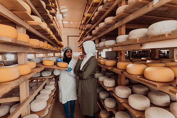 Image showing Arab business partner visiting a cheese factory. The concept of investing in small businesses