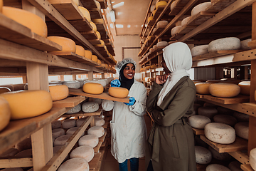 Image showing Arab business partner visiting a cheese factory. The concept of investing in small businesses