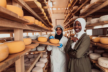 Image showing Arab business partner visiting a cheese factory. The concept of investing in small businesses