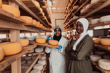 Image showing Arab business partner visiting a cheese factory. The concept of investing in small businesses