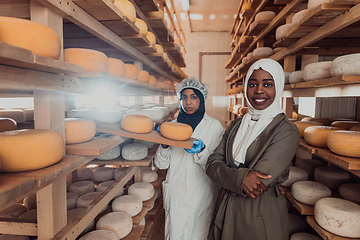 Image showing Arab business partner visiting a cheese factory. The concept of investing in small businesses