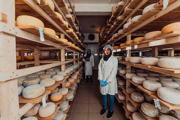 Image showing Arab business partner visiting a cheese factory. The concept of investing in small businesses