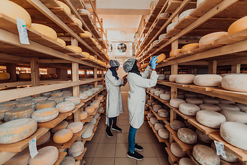 Image showing Arab business partner visiting a cheese factory. The concept of investing in small businesses