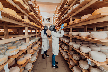 Image showing Arab business partner visiting a cheese factory. The concept of investing in small businesses