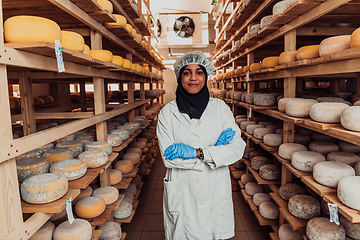 Image showing Arab investor in a warehouse of the cheese production industry