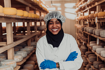 Image showing Arab investor in a warehouse of the cheese production industry