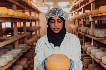 Image showing Arab investor in a warehouse of the cheese production industry