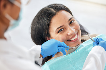 Image showing Dentist, dental care and teeth smile of a woman with tools and hands of a professional by mouth. Portrait of a female patient for orthodontics, healthcare and cleaning or inspection for oral health