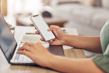 Image showing Hands, typing on laptop with phone and remote work, freelancer checking email screen or social media mockup. Networking, online research in virtual space and technology with mobile app in home office