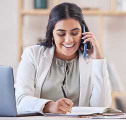 Image showing Business woman, phone call and writing in office for networking, schedule and communication. Happy indian female worker talking on smartphone, planning agenda and calendar administration in notebook