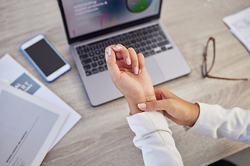 Image showing Hands, business woman and pain in wrist from typing on laptop, orthopedic injury or health risk from above. Closeup of worker, carpal tunnel and muscle problem from stress, fibromyalgia and arthritis