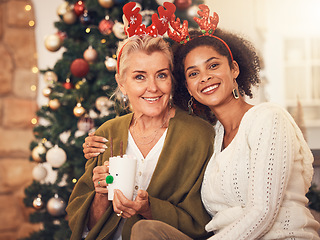 Image showing Portrait, christmas and blended family with a woman and daughter in law together in a home during the festive season. Smile, love and diversity with happy people in a house for december celebration