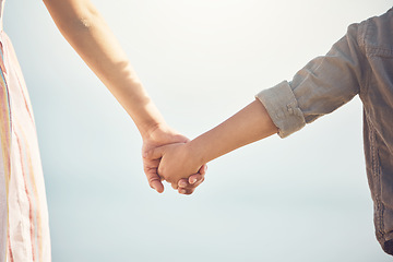 Image showing Love, support and holding hands with mother and child for trust, happy and safety on blue sky. Happiness, security and faith with closeup of woman and kid for family, care and kindness together