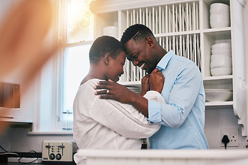 Image showing Hug, happy and a mature black couple in the kitchen with care, love and quality time in the morning. Happy, together and an African man and woman with gratitude or kindness in a house for romance