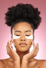 Image showing Skin, eye patch or face mask of a woman for dermatology, wellness and skincare glow. Collagen, detox and cosmetics of a black female model with a spa facial for self care on a pink studio background