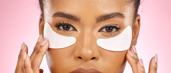 Image showing Woman, hydration pad and eyes in studio portrait, beauty and cosmetics with product for skin by pink background. Girl, model and facial self care with glow, natural skincare and aesthetic in closeup