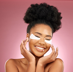 Image showing Skincare, happiness and black woman with mask on eyes, cosmetics and dermatology on pink background. Beauty, collagen product and model eye patches for healthy skin glow, smile and care in studio.