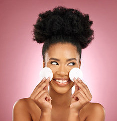 Image showing Black woman, cotton pad and skincare with makeup, dermatology and facial on a studio background. Female person, shine and happy model with cosmetics, aesthetic and cleaning with happiness and patches