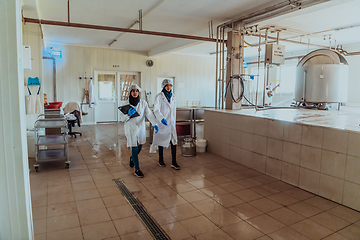 Image showing Arab business partner visiting a cheese factory. The concept of investing in small businesses