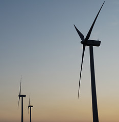 Image showing windturbines on sunset sky