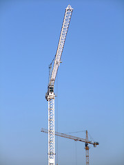 Image showing Two construction cranes 