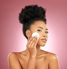 Image showing Black woman, cotton pad and portrait with makeup, dermatology and skincare on a studio background. Female person, shine and model with cosmetics, aesthetic and cleaning with beauty, glow and patches