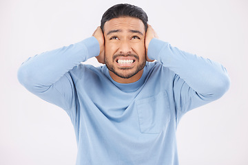 Image showing Stress, noise and man with hearing problem in studio isolated on a white background. Tinnitus, frustrated and person with loud sound, crisis and disaster for mental health, anxiety or headache pain