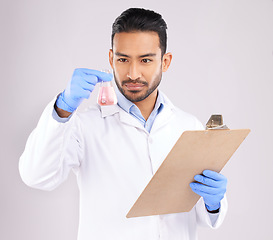 Image showing Young scientist man, beaker and checklist with thinking, analysis and notes in studio by white background. Asian science expert, clipboard and paperwork for chemistry, ideas and study at pharma job