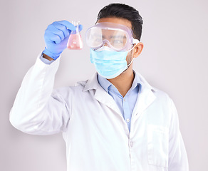 Image showing Medical, chemical and man with research, test and scientific breakthrough against a white studio background. Research, male person and model with safety, cure and container with liquid and chemistry