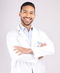 Image showing Man, portrait and scientist smile with arms crossed in studio isolated on a white background. Confidence, face and Asian doctor of science, research expert or happy medical professional from Cambodia