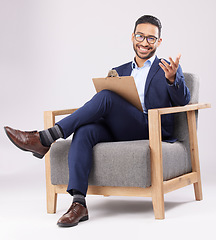 Image showing Psychologist, therapist and a man with a chair and clipboard for therapy, consultation or support. Portrait of professional person with notes for mental health counselling on white studio background