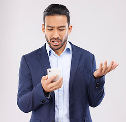 Image showing Phone, fail and asian man in studio confused with scam, alert or internet glitch on grey background. Stress, smartphone and online problem for Japanese guy angry by spam, phishing or 404 error crisis