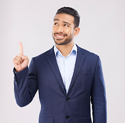 Image showing Solution, pointing and presentation with business man in studio for idea, advertising and news. Question, space and announcement with person on white background for promotion, mockup and information