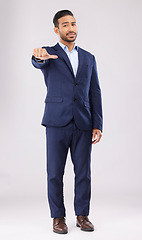 Image showing Neutral review, portrait and businessman in suit on a studio background for marketing or feedback. Choice, sign language and an Asian lawyer with a thumb gesture for a decision isolated on a backdrop