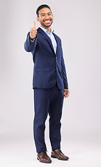 Image showing Happy businessman, portrait and thumbs up for approval, success or winning against a white studio background. Asian man smile with like emoji, yes sign or good job for business agreement or thank you