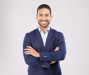 Image showing Happy business man, arms crossed and studio portrait with pride, success and suit by white background. Young asian entrepreneur, smile and excited for finance company, corporate career and ambition