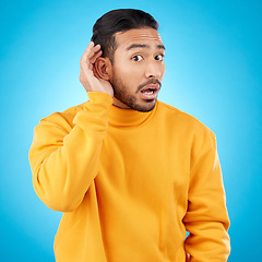 Image showing Attention, surprise and asian man with listening to news with asian in studio background for information. Secret, hearing and hand on ear with male person or shocked face in mock up with gossip.