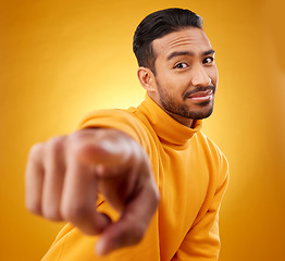 Image showing Portrait, asian man and hand pointing in studio with you, sign or thank you gesture on yellow background. Face, finger and Japanese male model with selection, choice or decision, vote or attention