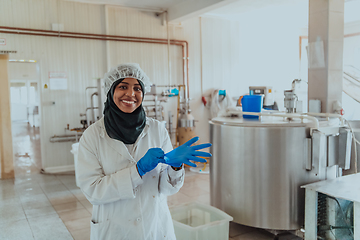 Image showing Arab business woman visiting a cheese factory. The concept of investing in small businesses