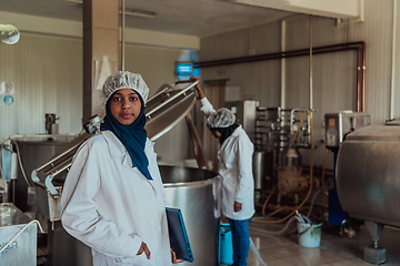 Image showing Arab business partner visiting a cheese factory. The concept of investing in small businesses