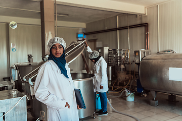 Image showing Arab business partner visiting a cheese factory. The concept of investing in small businesses