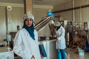 Image showing Arab business partner visiting a cheese factory. The concept of investing in small businesses