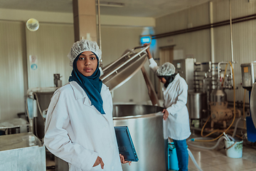 Image showing Arab business partner visiting a cheese factory. The concept of investing in small businesses